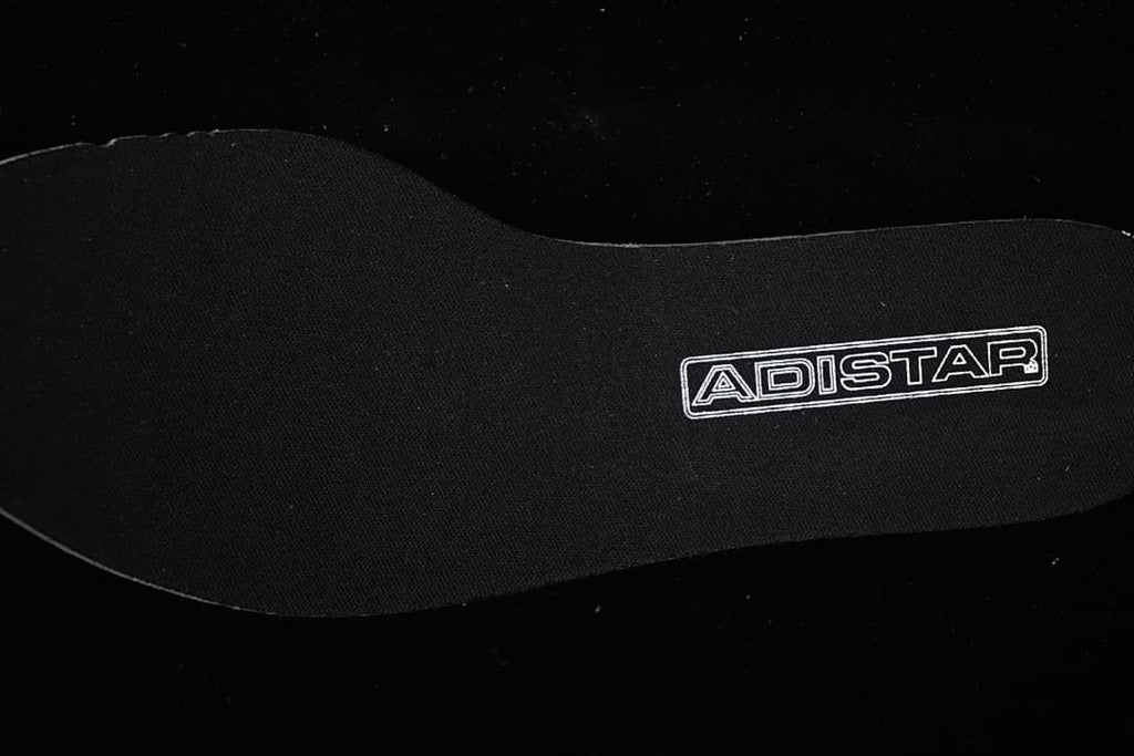 Black insole marked Adistar
