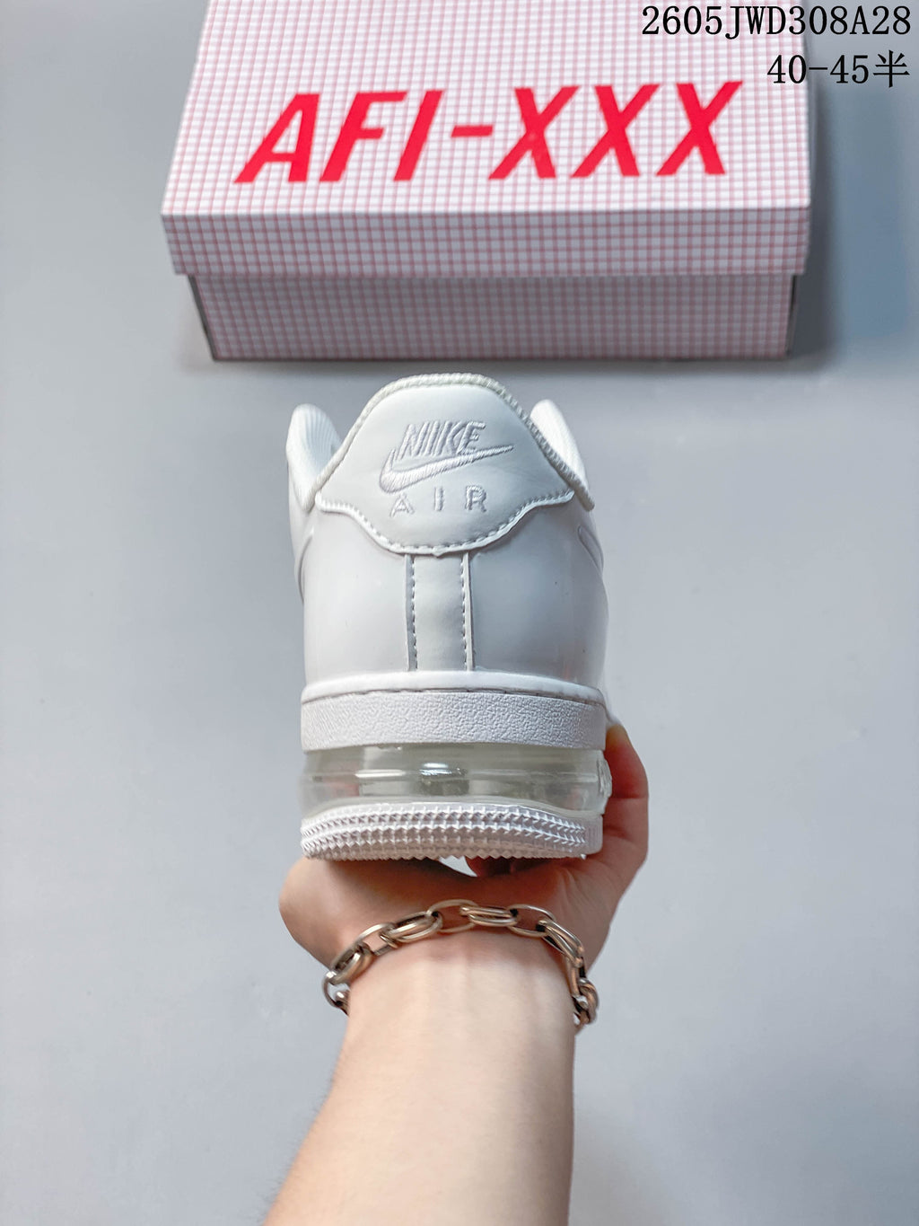 Rear view of a white sneaker with visible heel cushioning