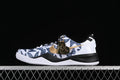 Side view of a Nike Kobe 8 Protro shoe with a white and navy patterned upper, gold swoosh, black midsole accents, and heart-shaped charm.
