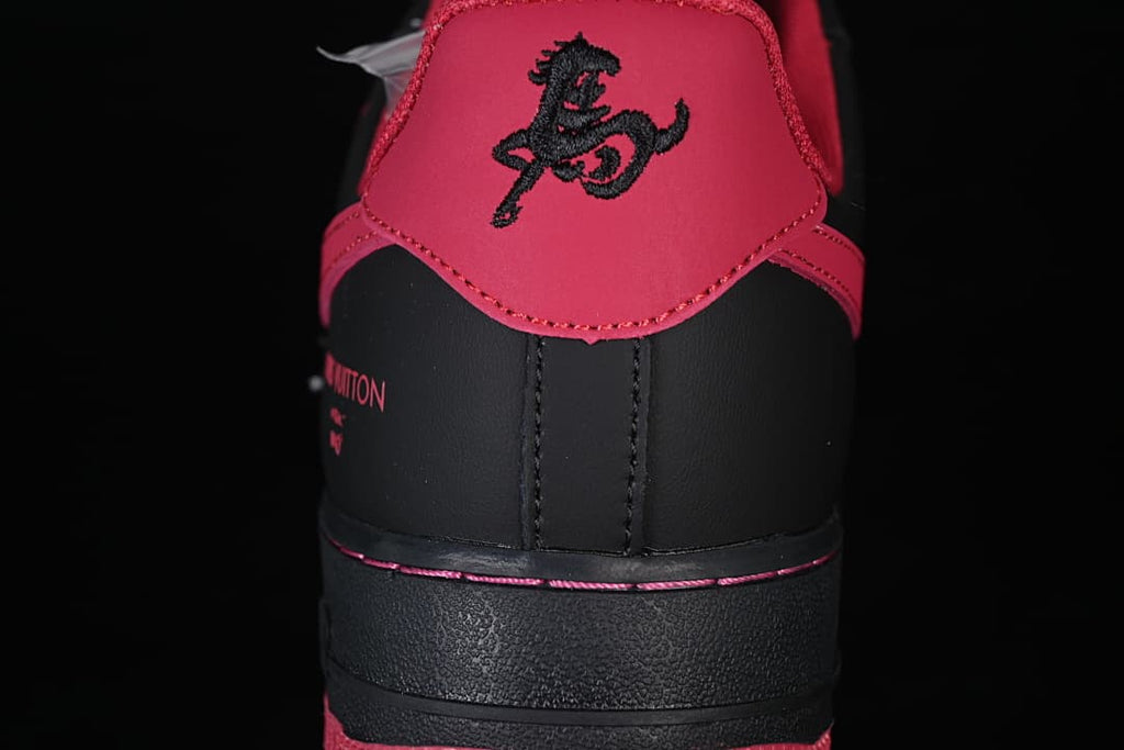 Rear view showing red heel tabs with embroidered motifs