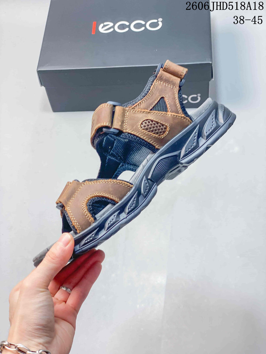 Side view of the sandal showing its adjustable straps, open design, and treaded outsole.