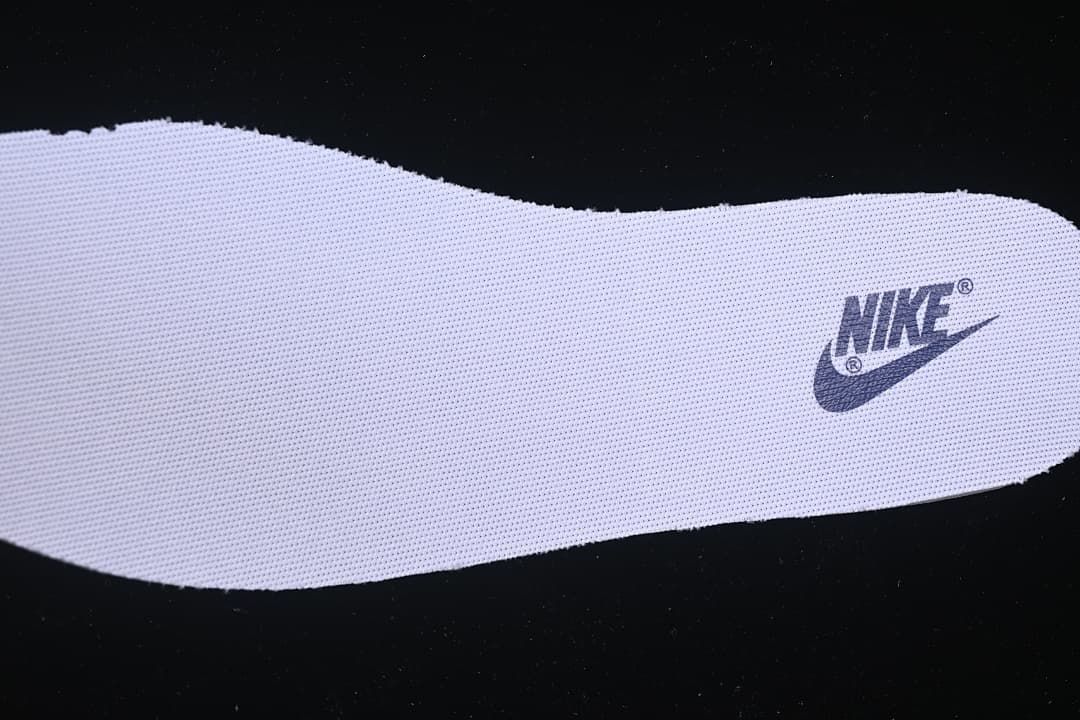 Close-up of a white insole with a Nike logo