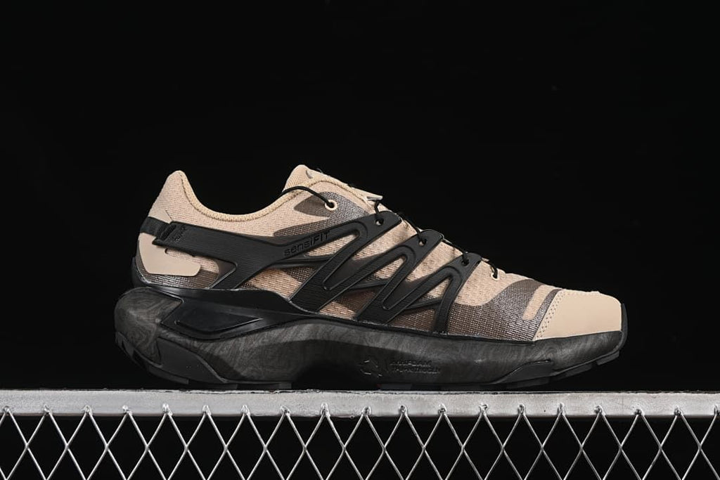 Side profile showing the dark midsole and cage-style supports.