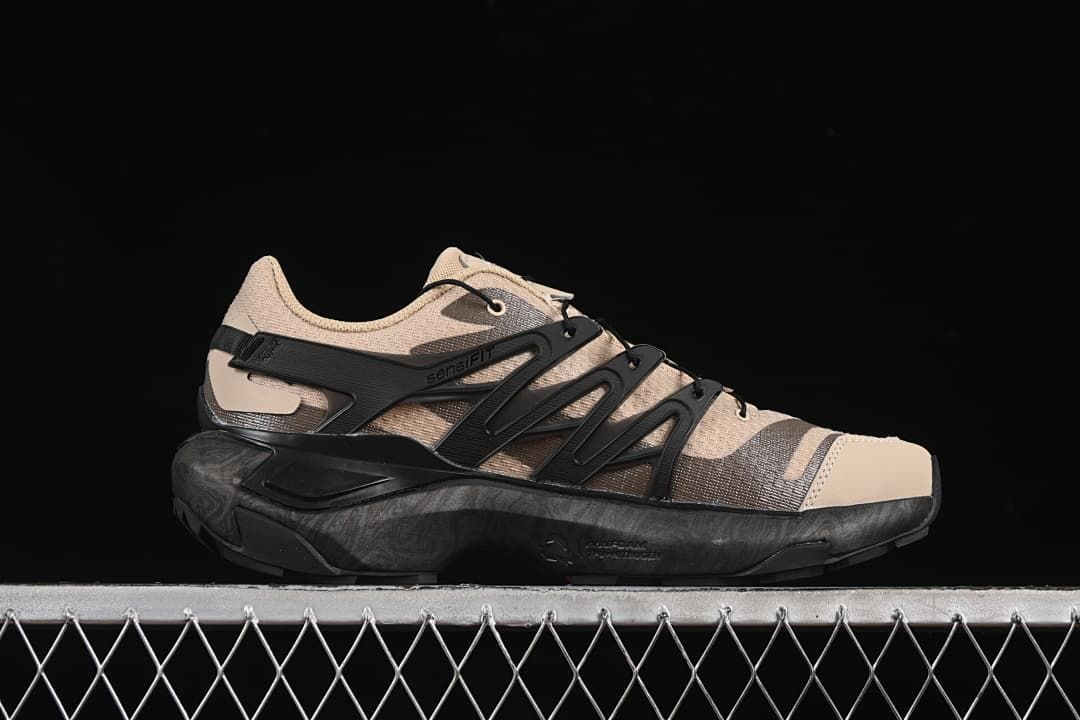 Side profile showing the dark midsole and cage-style supports.