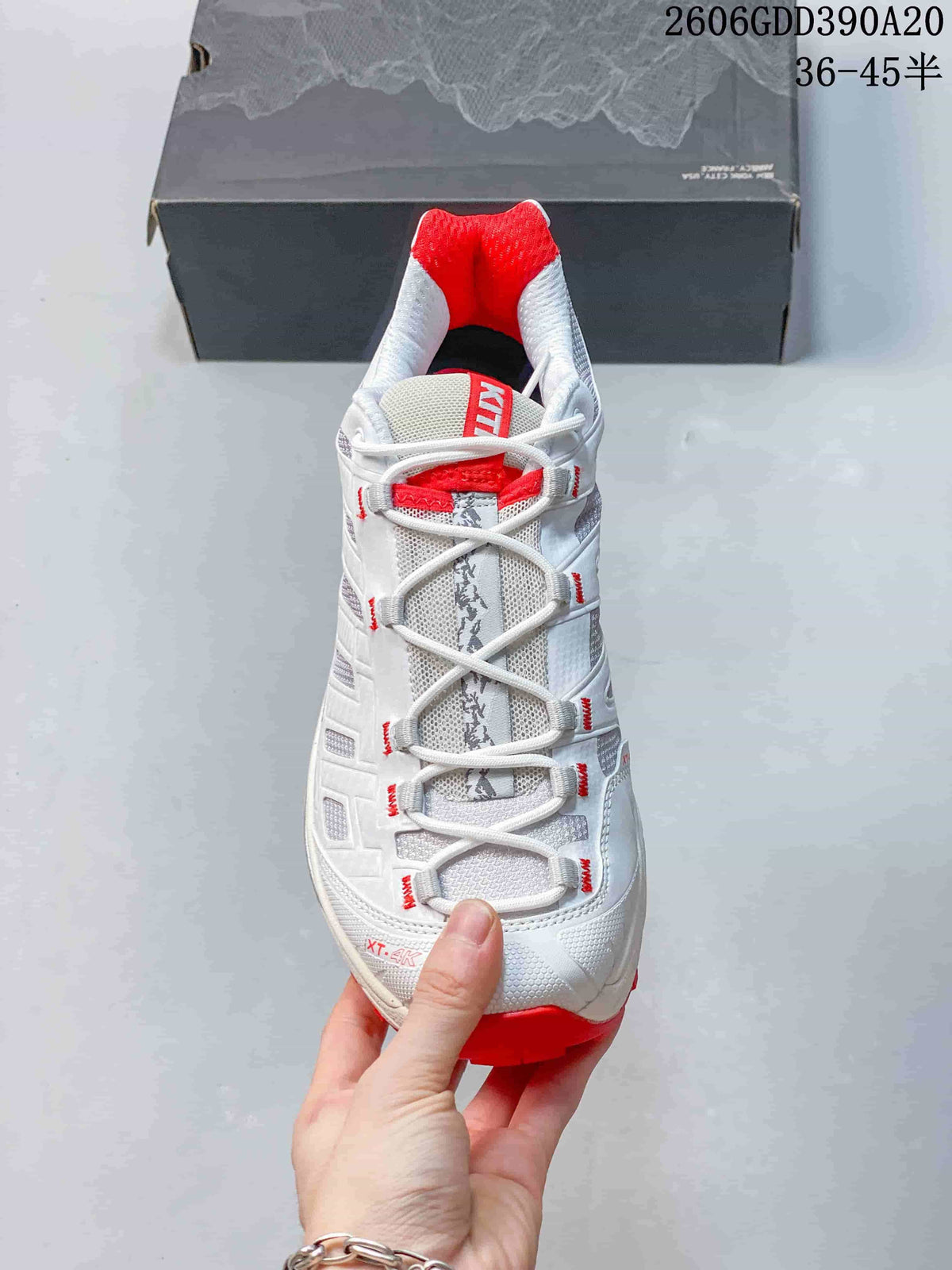 Front view showing the lace-up design, gray detailing, and red lining