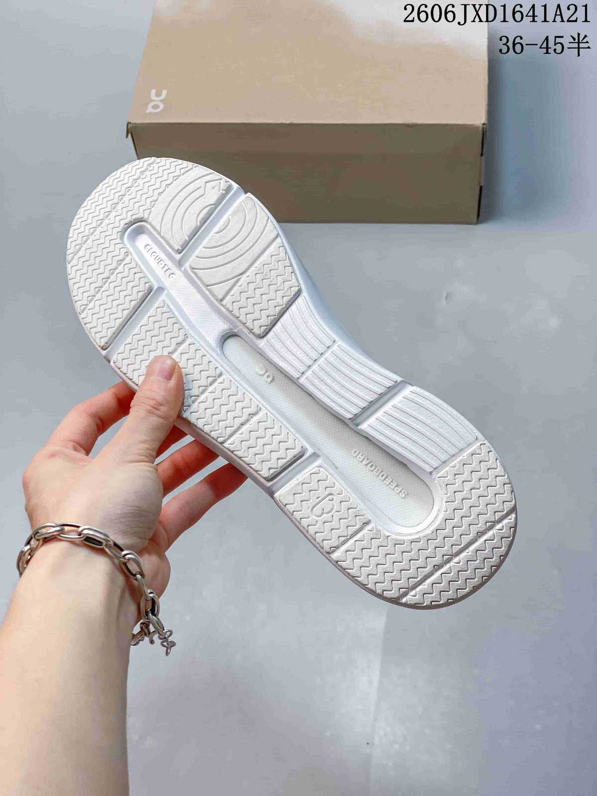 Underside of a white sneaker showing the textured outsole