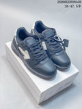 Pair of charcoal-gray low-top lace-up sneakers with white arrow-shaped side details on a box