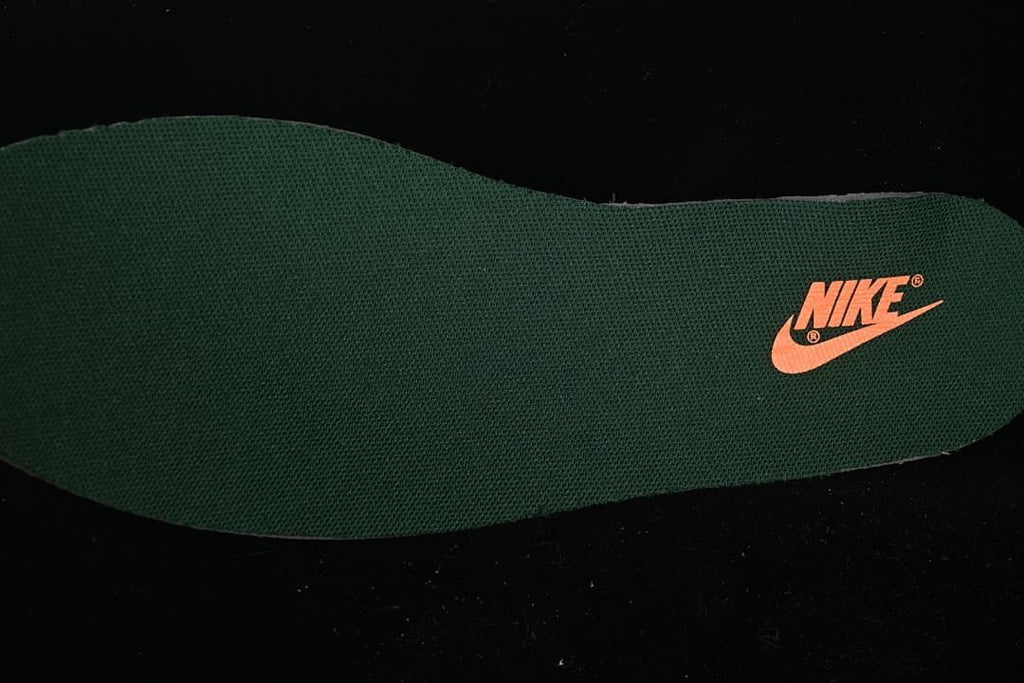 Green insole with orange Nike branding