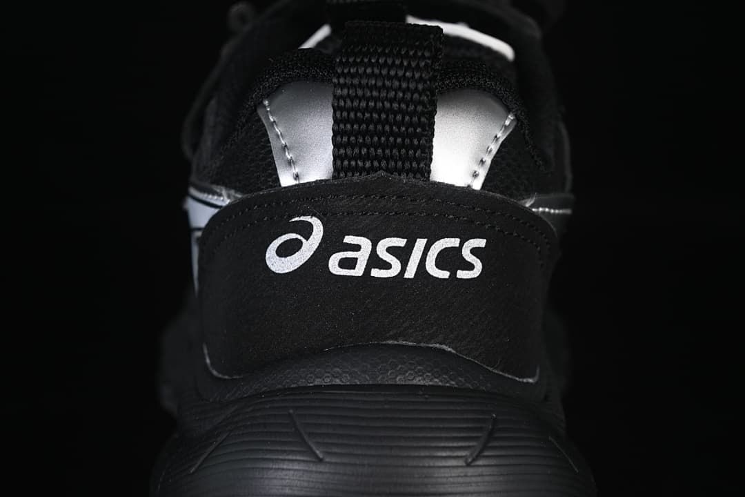 Rear close-up of the sneaker with ASICS branding and silver heel details.