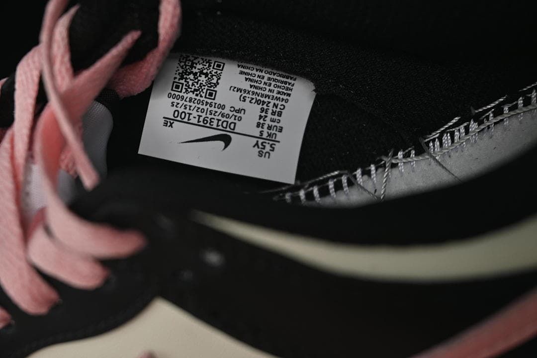 Interior shoe size label visible beside pink laces