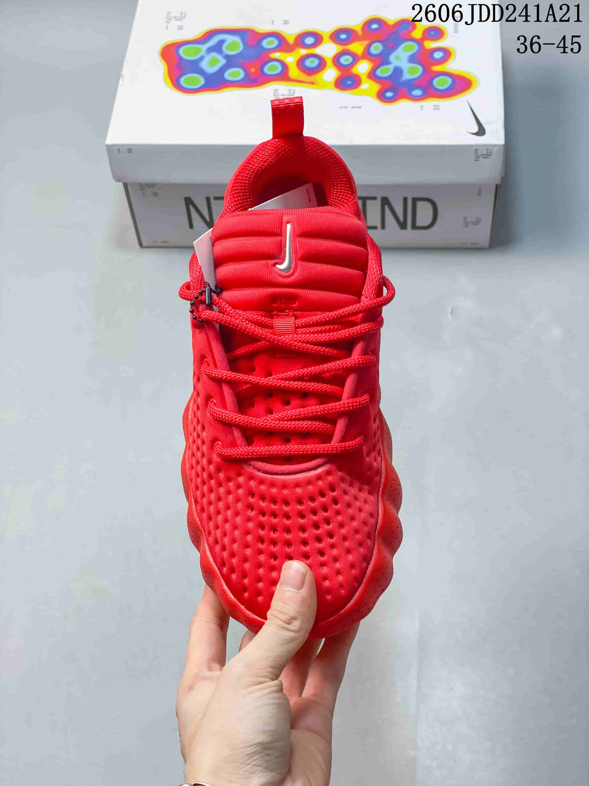 Front view of the red lace-up shoe with textured toe and padded tongue