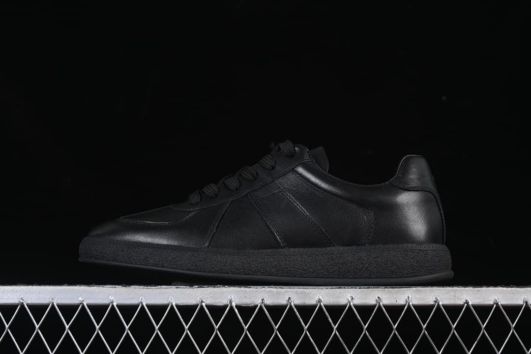 Side view of a black ECCO low-top lace-up sneaker