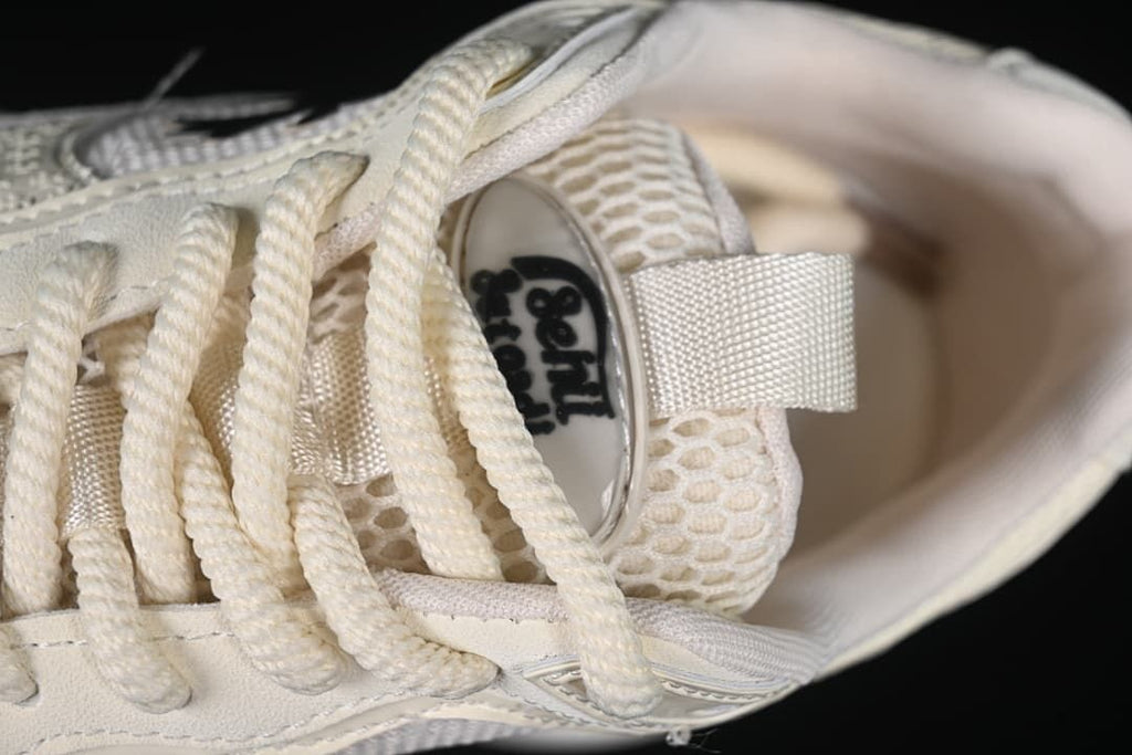 Close-up of the laces, tongue, and mesh-look upper