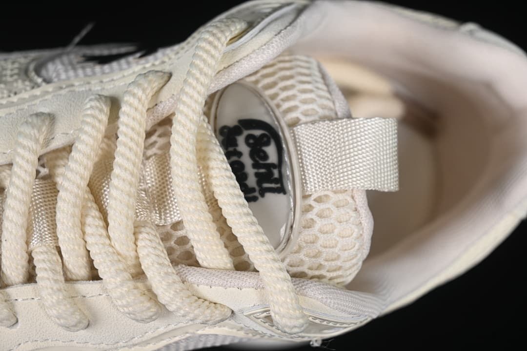 Close-up of the laces, tongue, and mesh-look upper