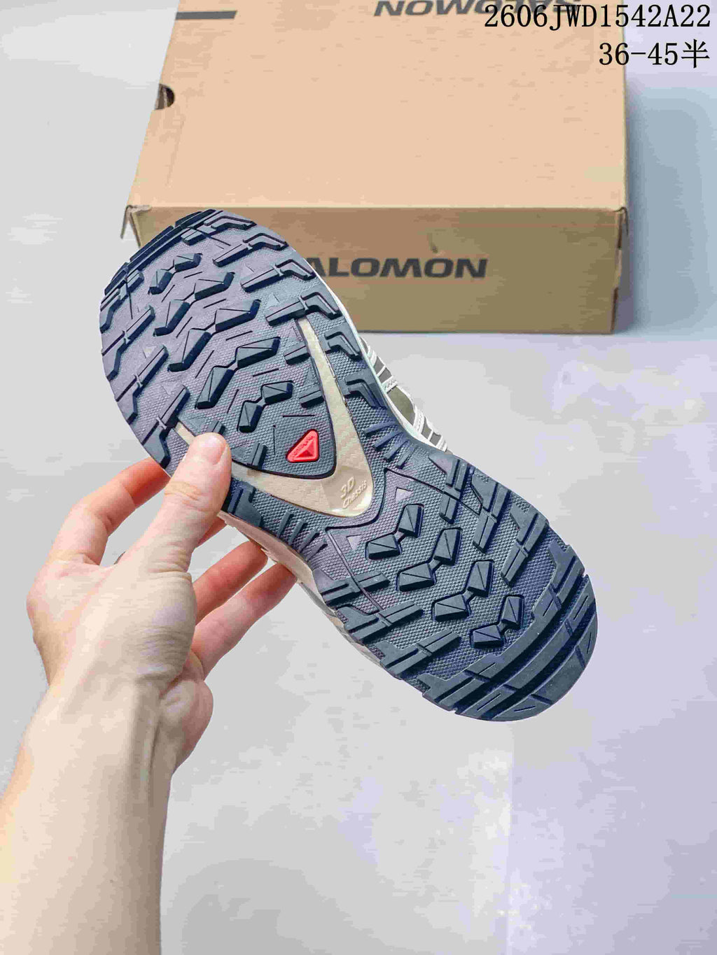 Close view of the sneaker outsole showing a rugged tread pattern