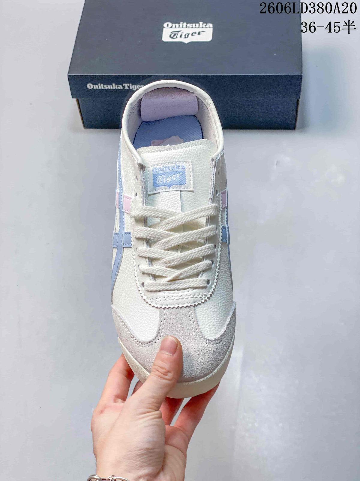 Top view of a lace-up sneaker with a white-toned upper and light-colored toe overlay.