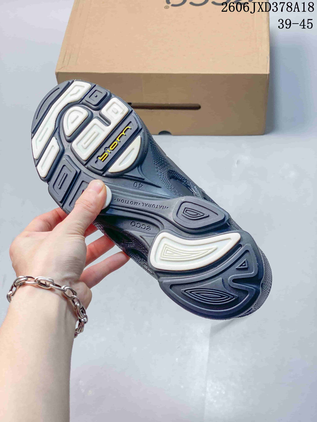 Outsole of a black ECCO BIOM sneaker with segmented tread