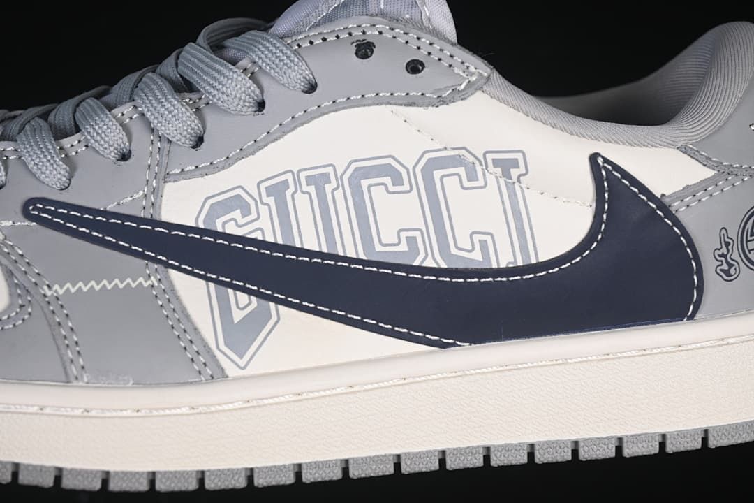 Close-up of the dark navy Swoosh and outlined side-panel lettering.
