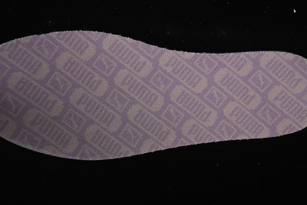 Close-up view of the patterned underside of a removable insole.