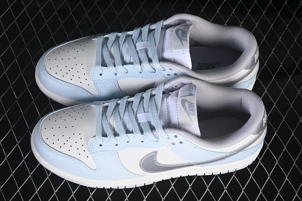 Pair of light blue, white, and silver low-top sneakers