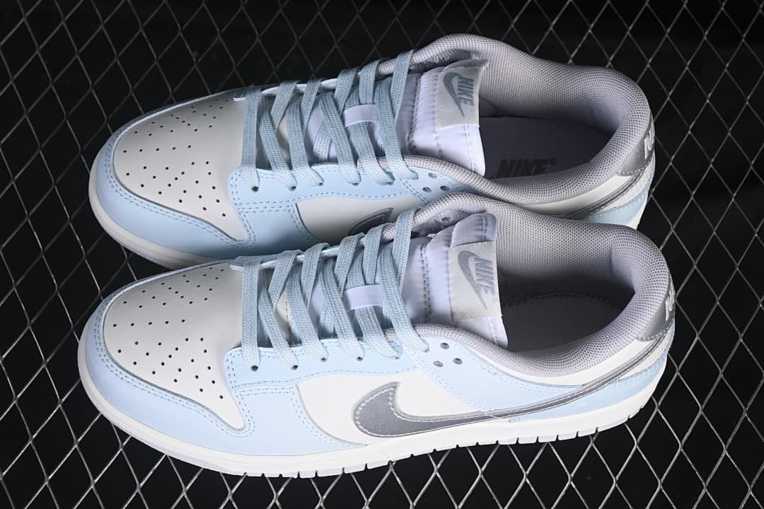 Pair of light blue, white, and silver low-top sneakers