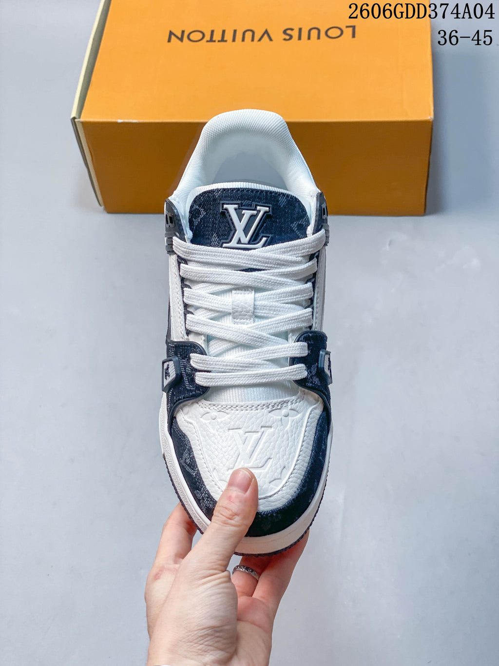 Front view showing the laces, tongue, and toe panel of a Louis Vuitton Trainer sneaker.