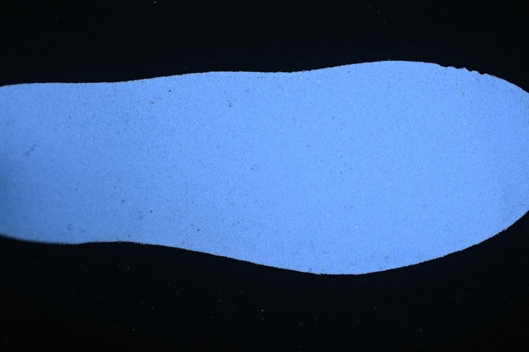 Blue-lit view of a shoe insole.
