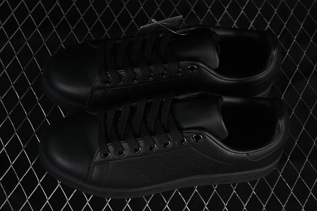 Pair of black Stan Smith sneakers viewed from above