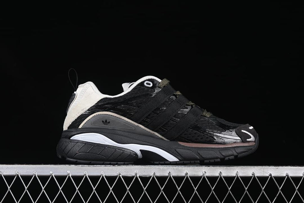 Side profile of the sneaker with layered panels and a thick sculpted sole.