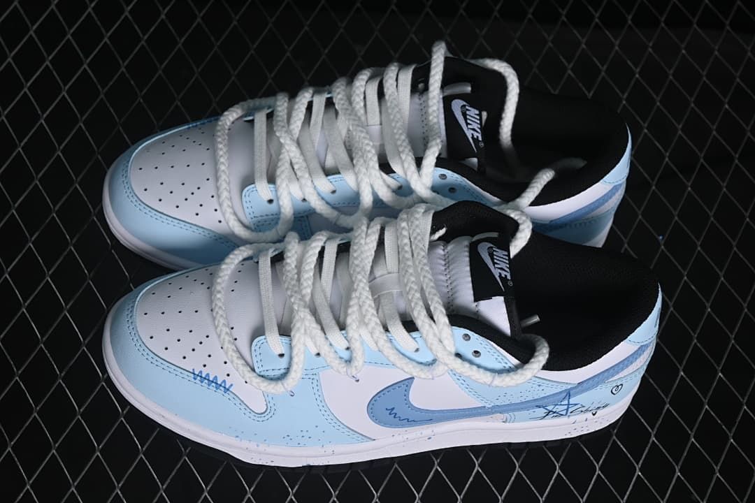 Pair of white and light-blue low-top sneakers with oversized rope laces