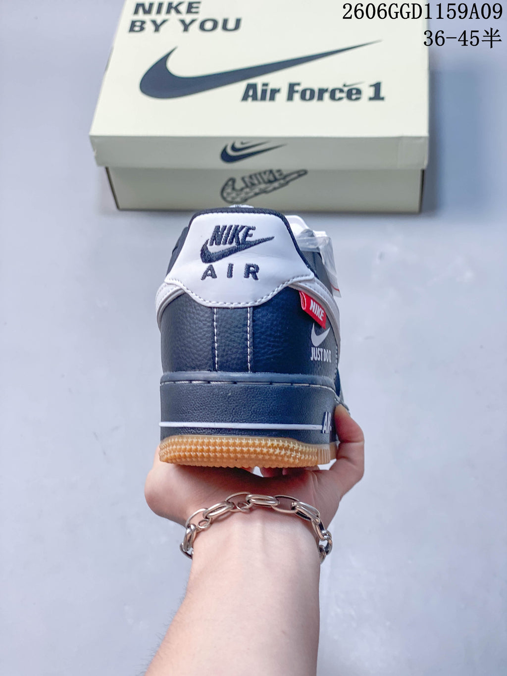 Rear view showing the heel branding, red detail, and gum-colored outsole.
