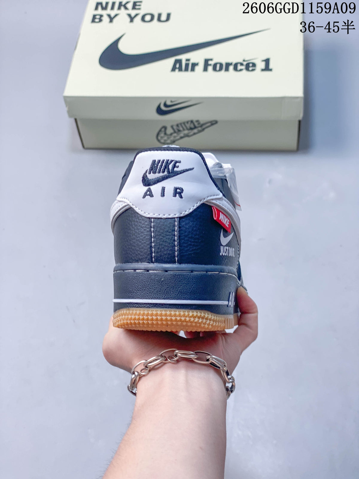 Rear view showing the heel branding, red detail, and gum-colored outsole.