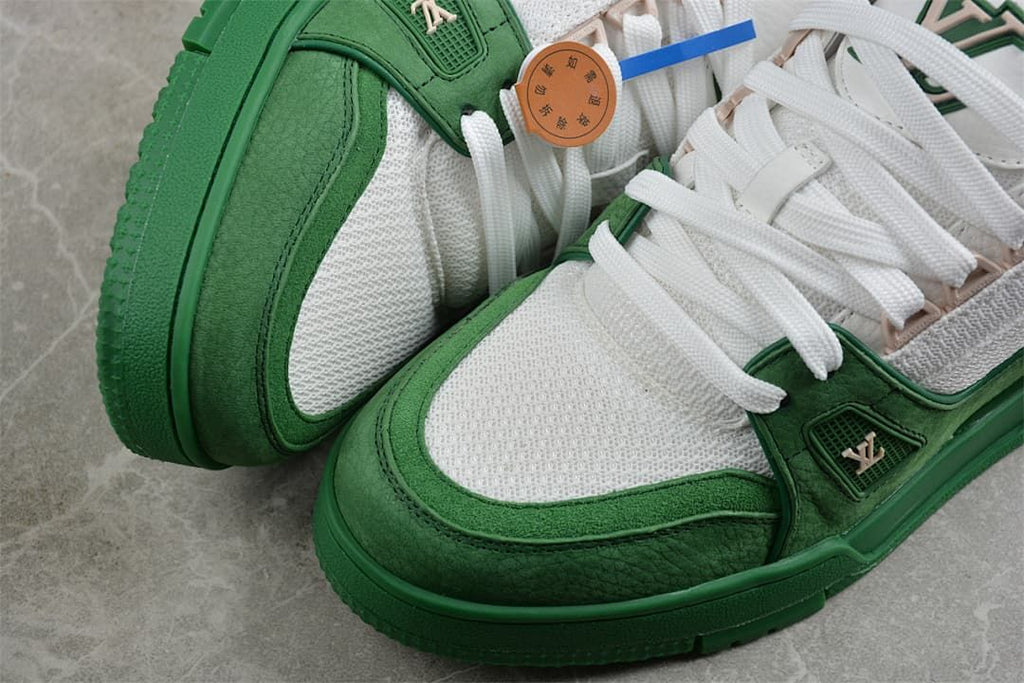 Close-up view of green overlays, white panels, and laces