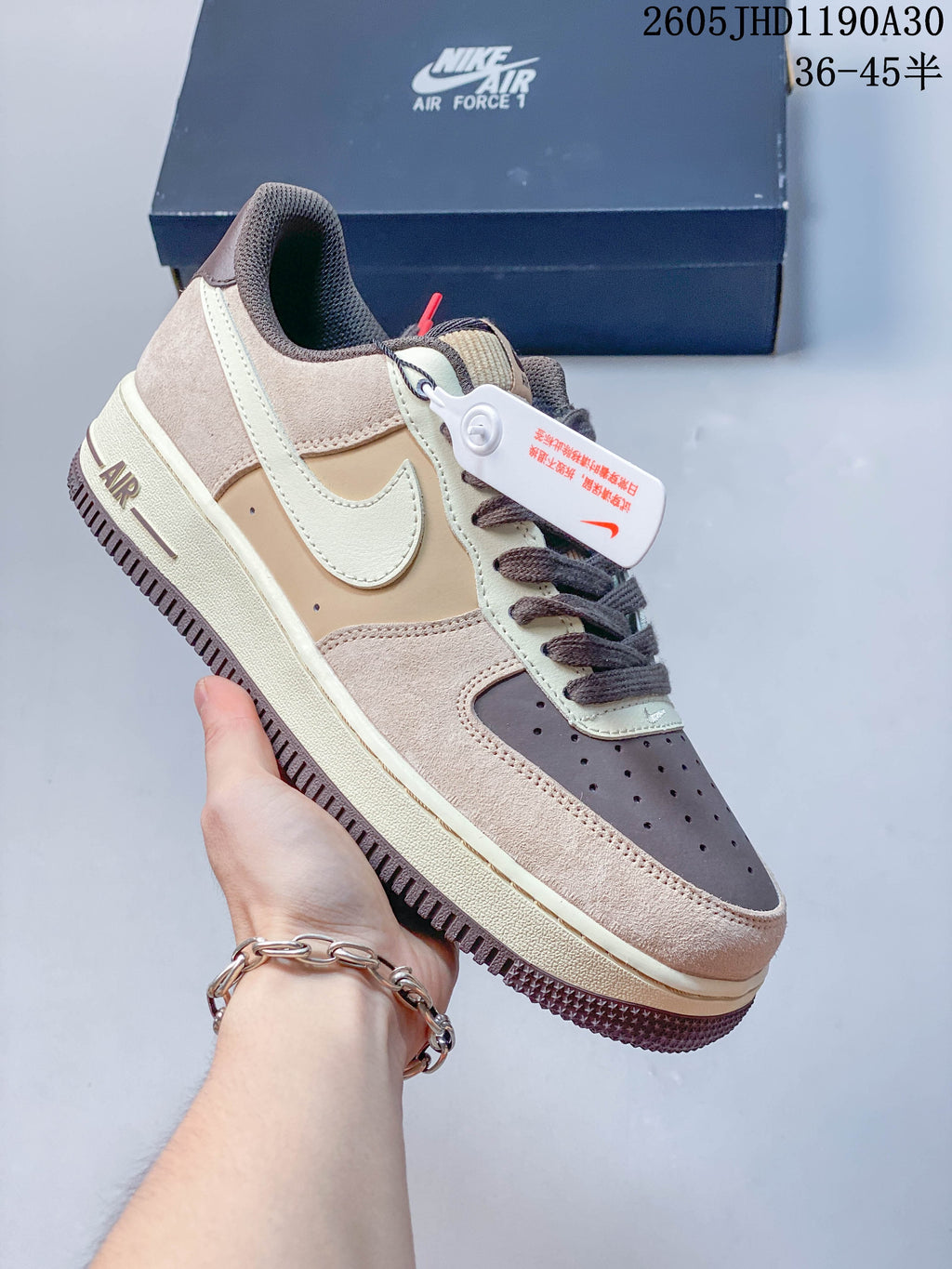 Angled side view of the Nike Air Force 1 sneaker with a light Swoosh and layered panels