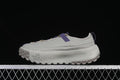 Side view of clay grey The North Face low-top shoes with purple accents.