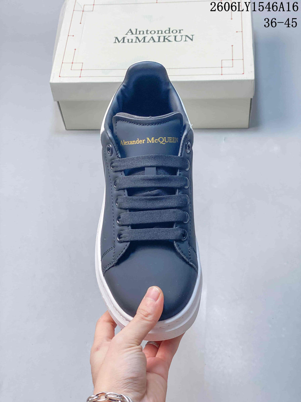 Front view of a navy lace-up sneaker with a chunky white sole