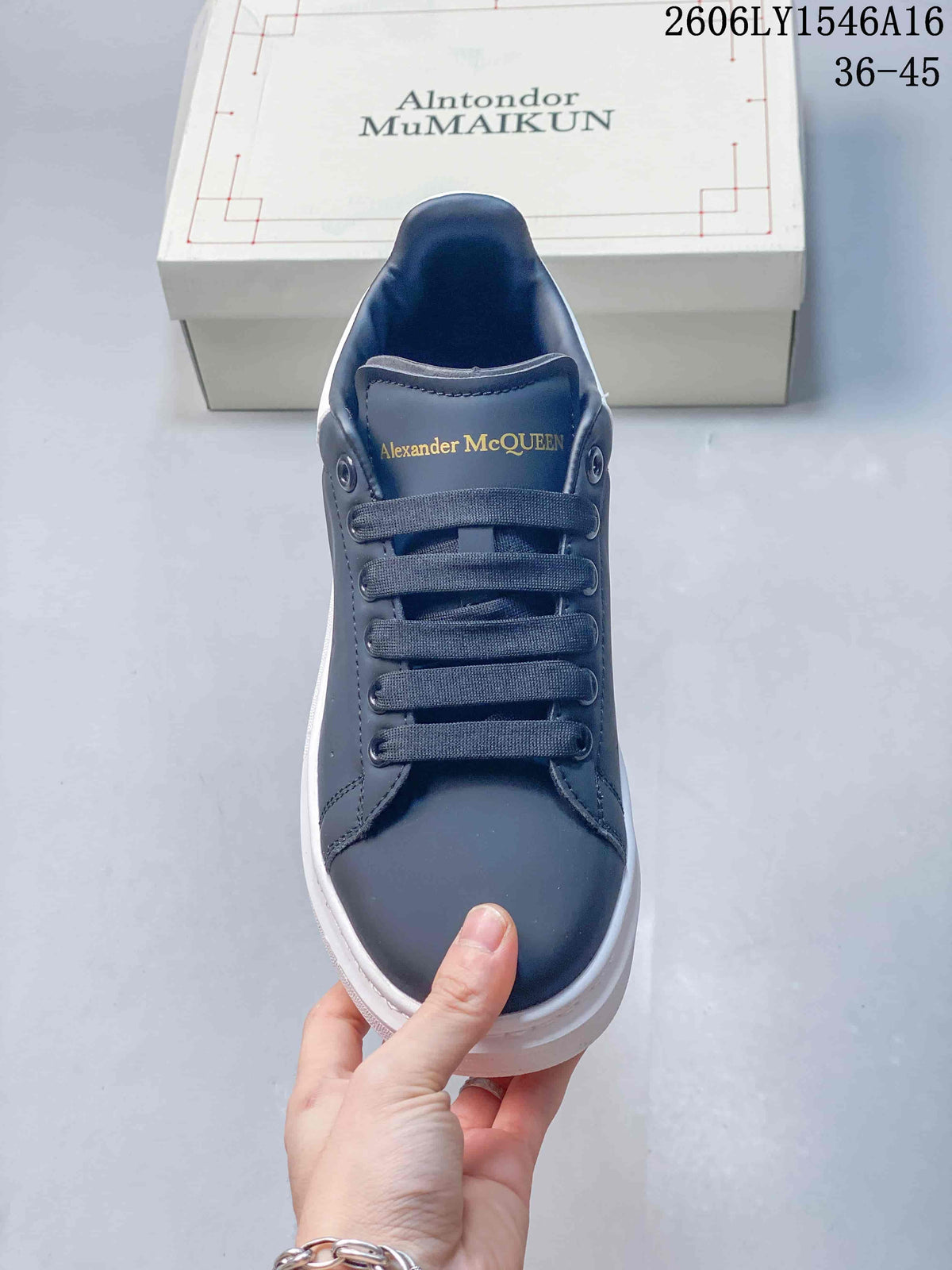Front view of a navy lace-up sneaker with a chunky white sole