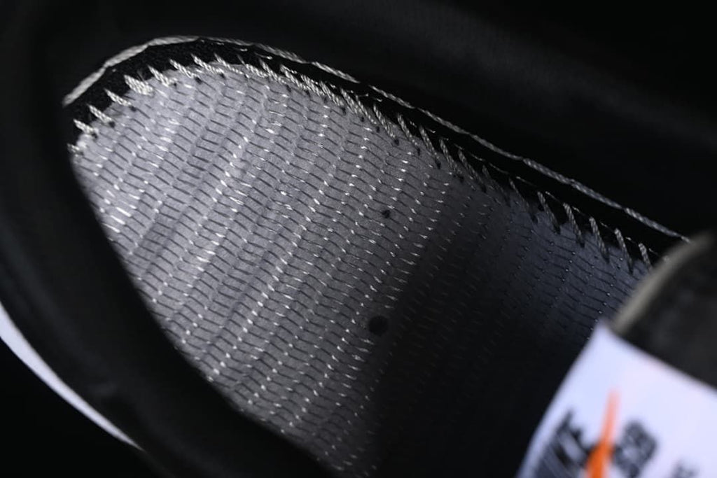 Close-up of the shoe's dark interior lining and stitching.
