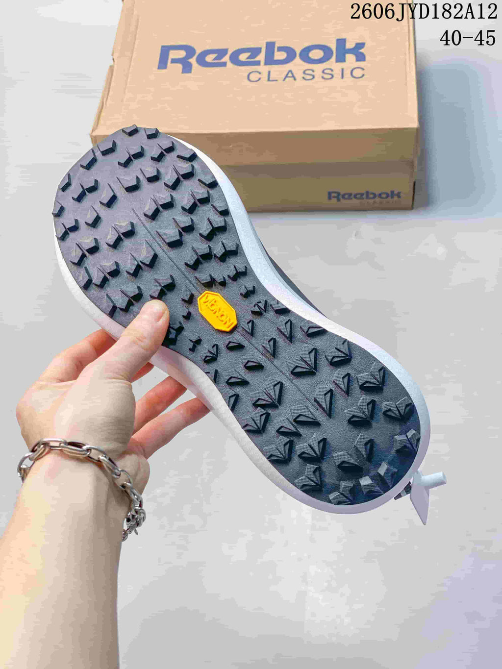 Close-up of the lugged outsole on a Reebok sneaker