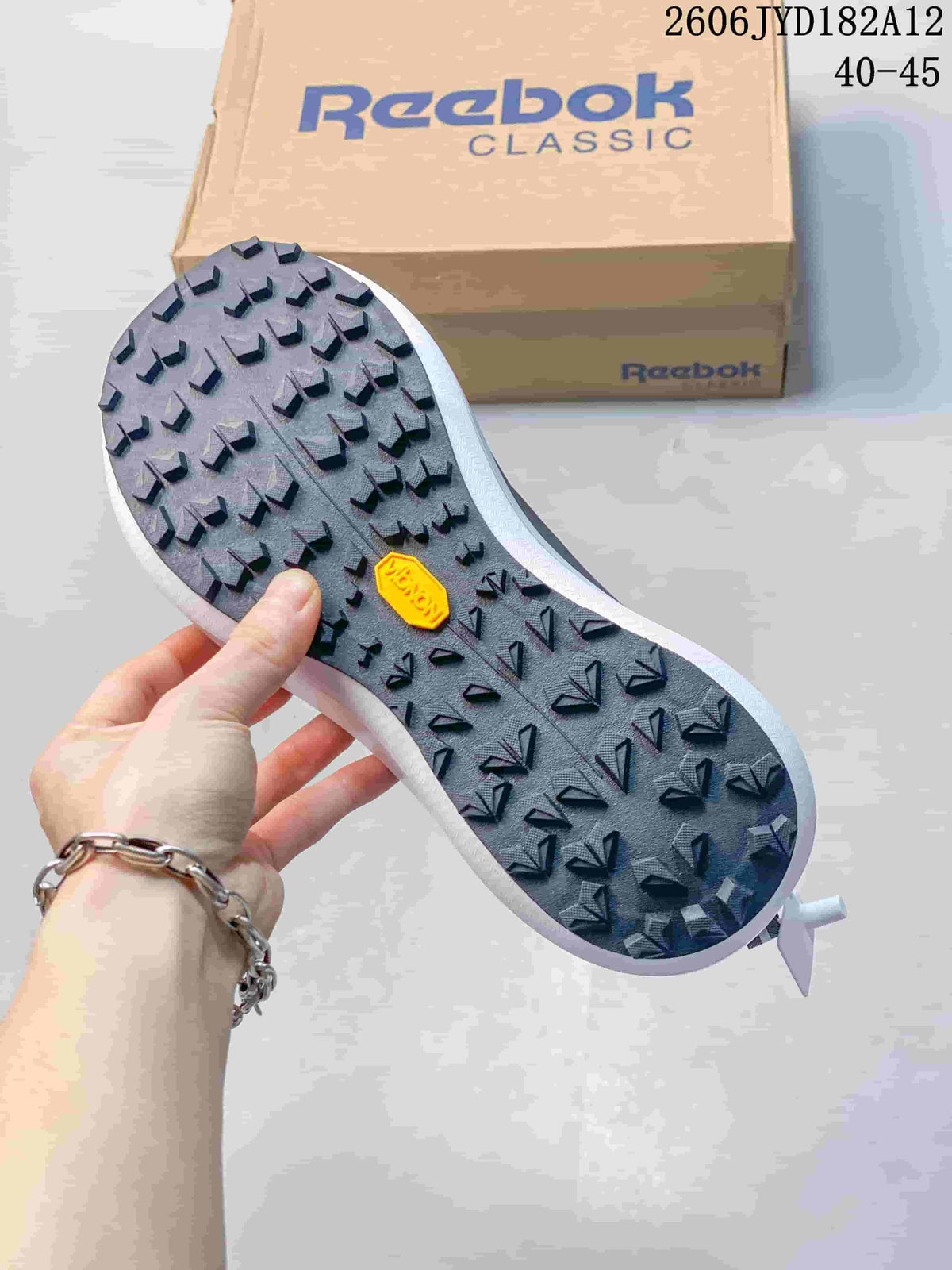 Close-up of the lugged outsole on a Reebok sneaker