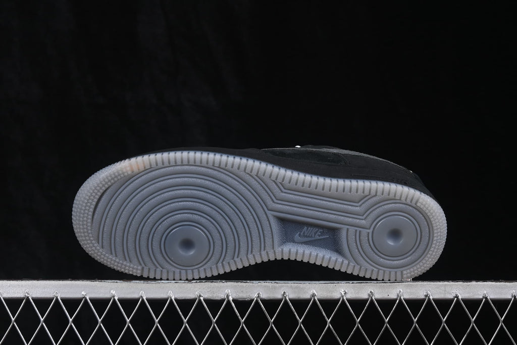 Bottom view showing the circular outsole tread pattern and Nike branding.