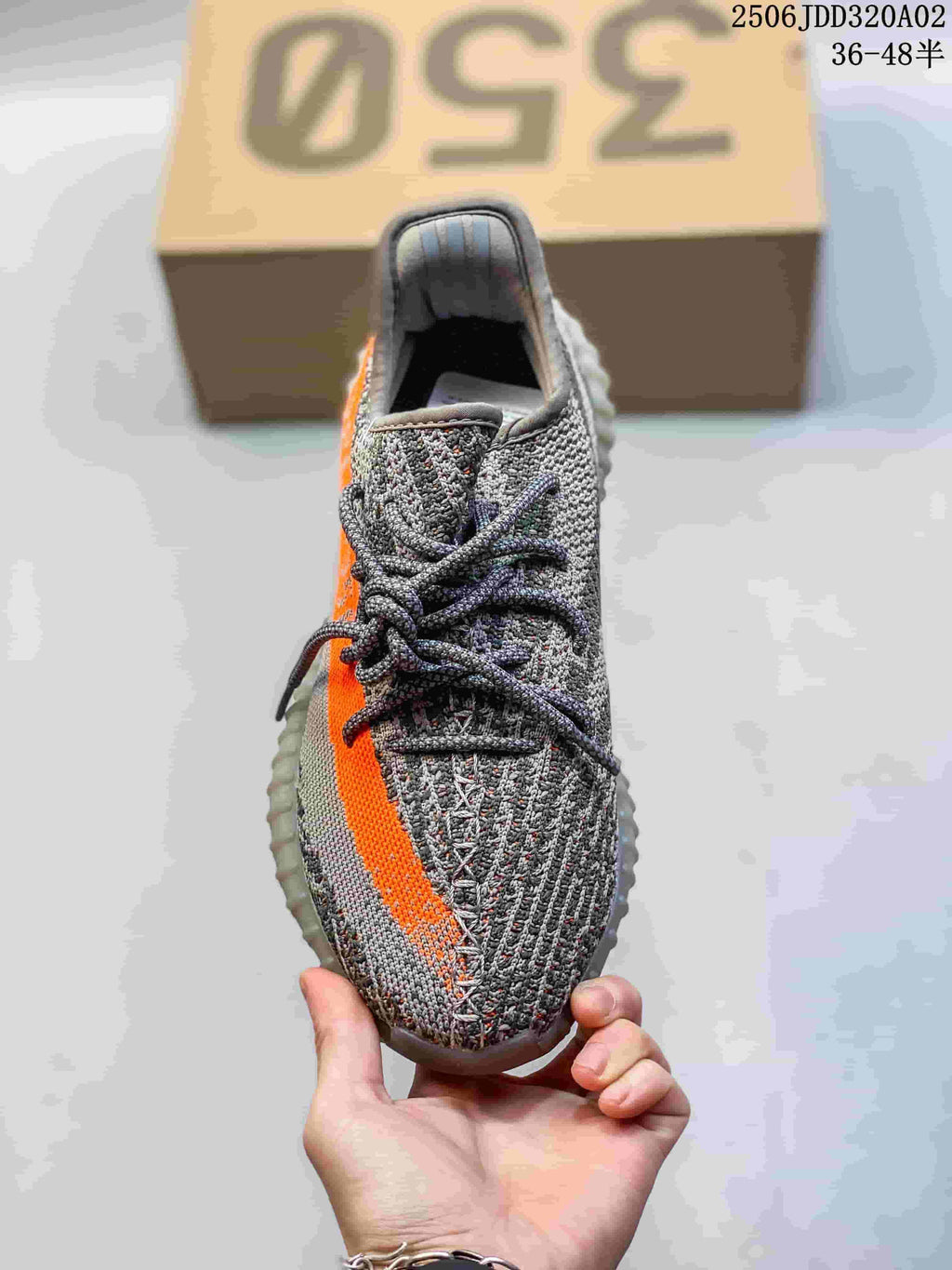 Top view of a gray lace-up sneaker with an orange side stripe; image overlay states 36–48.5.