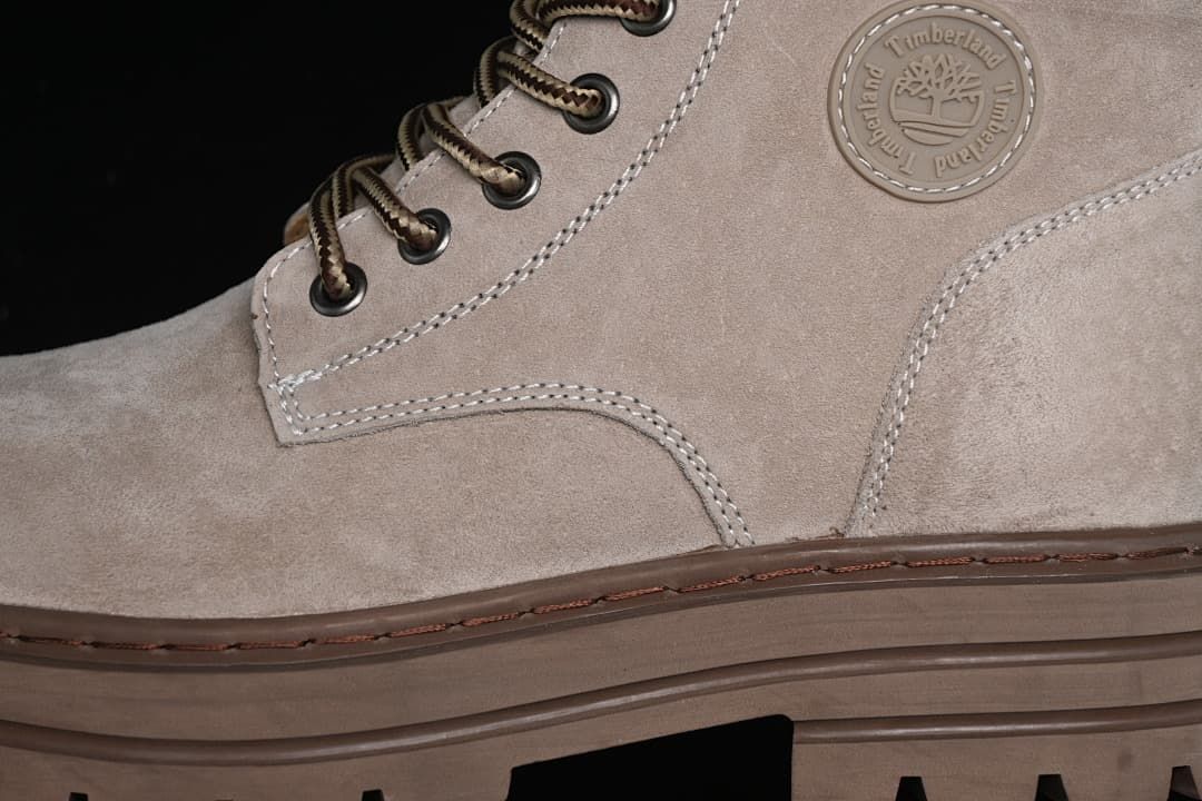 Close-up of the side emblem, stitched panels, laces, and outsole