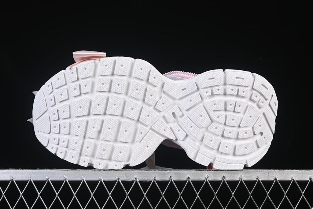 Underside view showing the white segmented tread pattern.