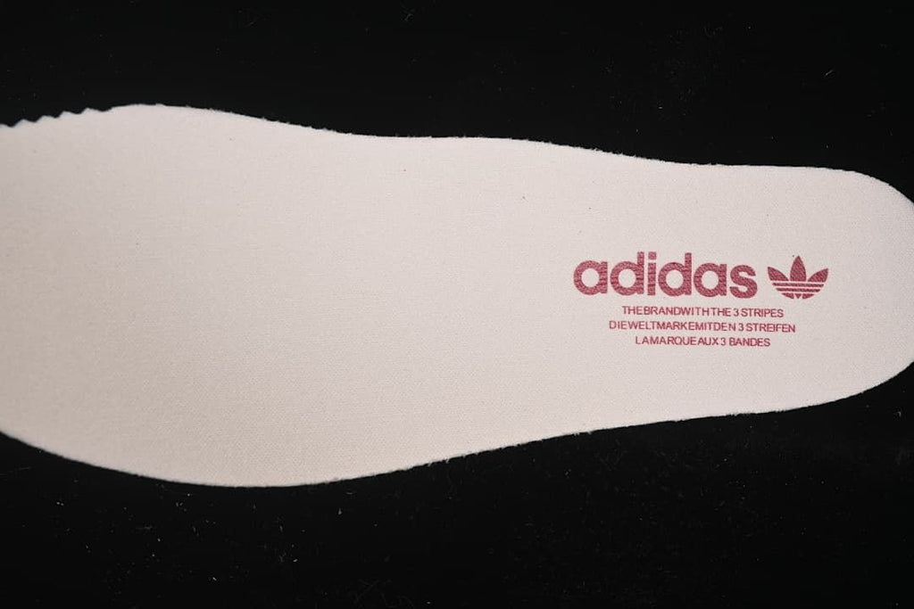 Close-up of an insole with adidas branding.