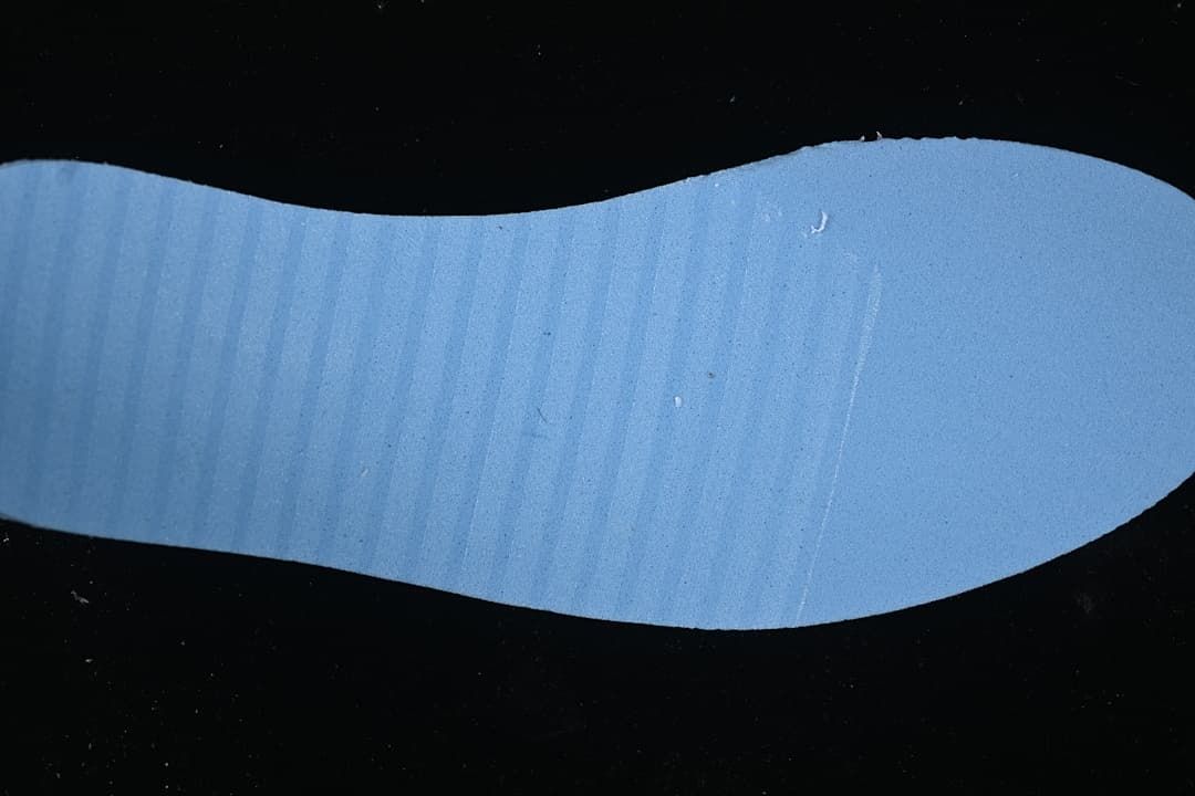 Blue-toned view of a sneaker insole.