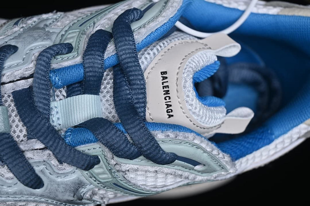 Top close-up of the laces and branded side detail