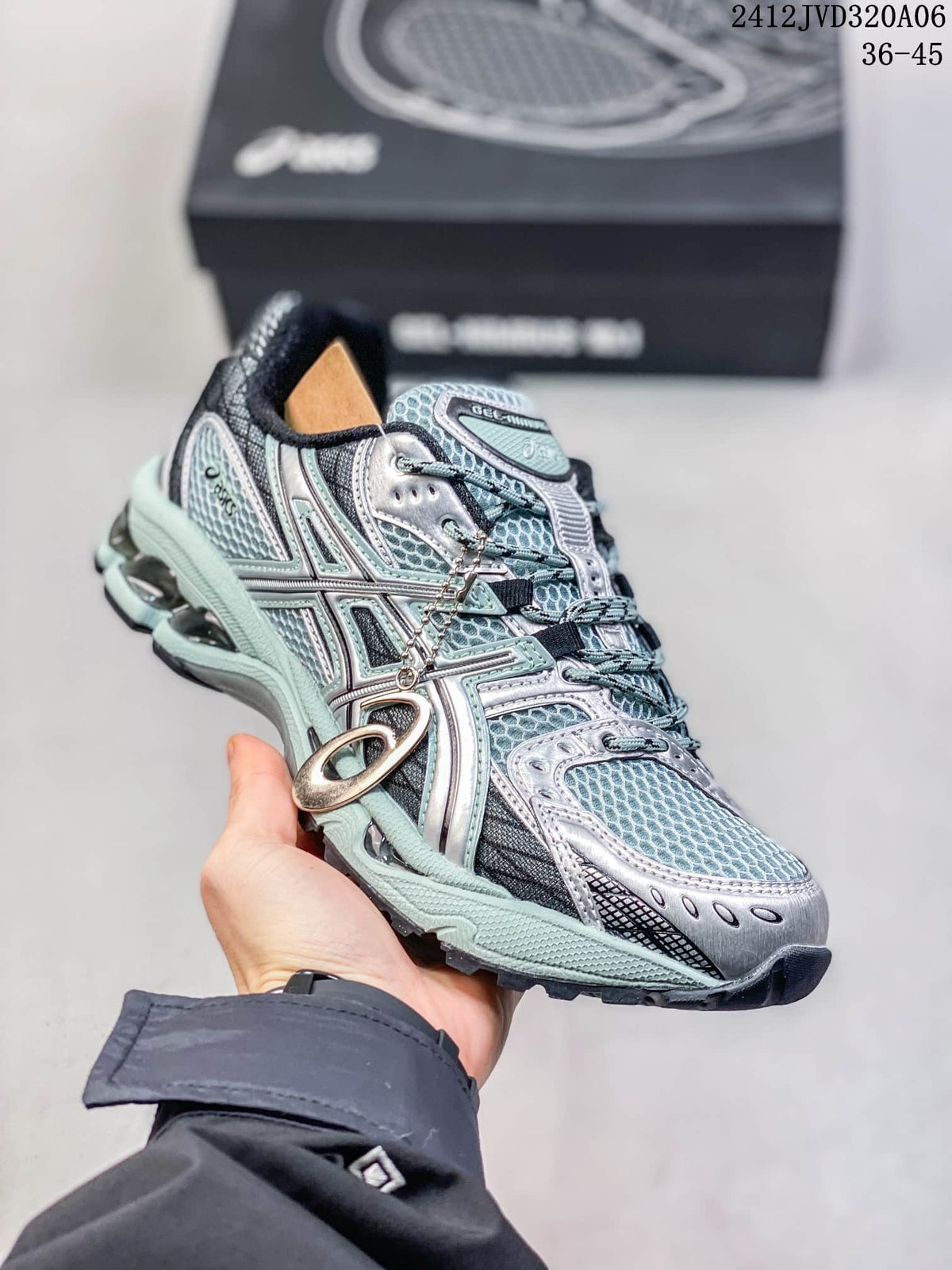 Close side view of the silver and mint sneaker with lace charm