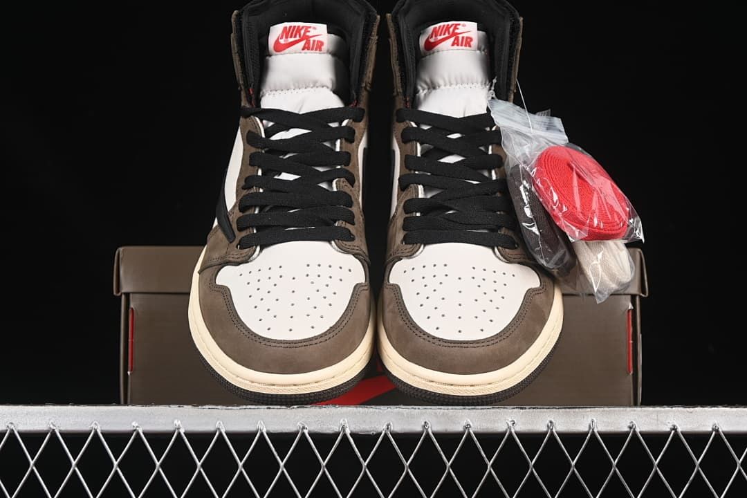 Front view of the pair with white perforated toe panels and extra red laces