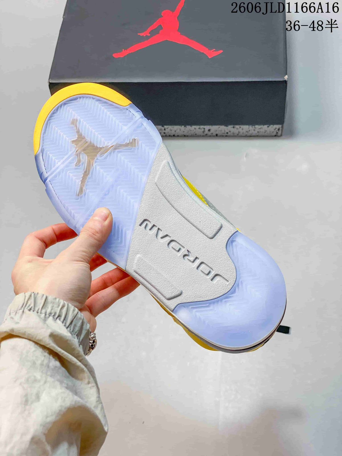 Translucent outsole of a yellow Air Jordan 5 Retro sneaker